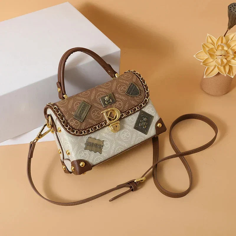 Zelda™ Vintage Crossbody Bag with Monogram and Gold Accents